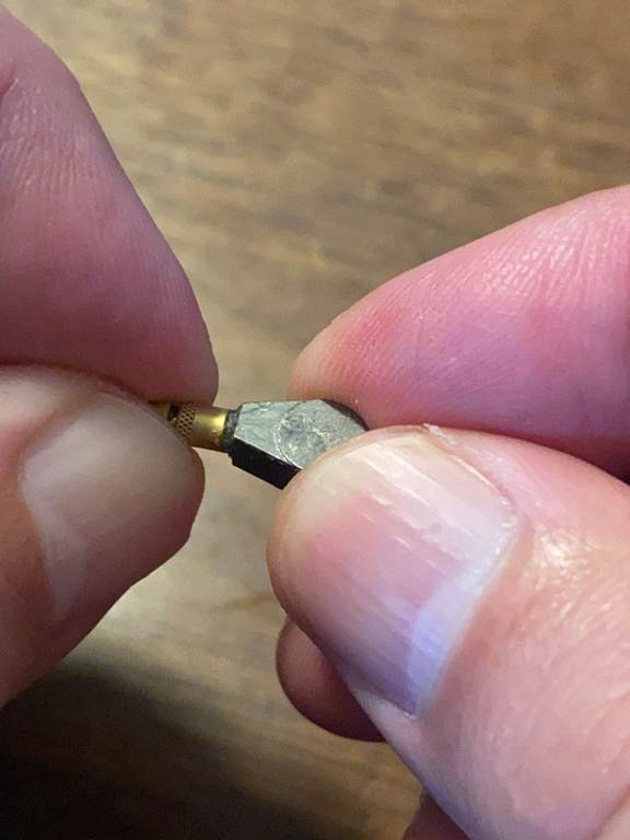 A person holding a screwdriver

AI-generated content may be incorrect.