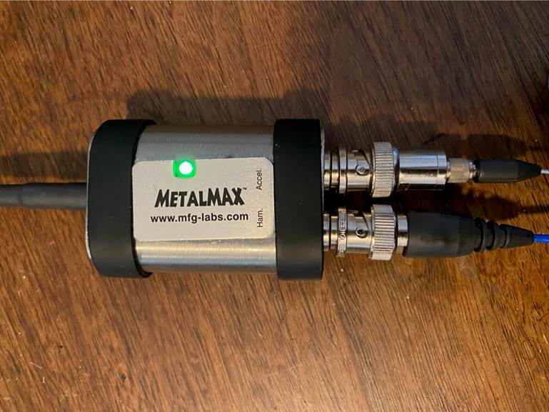 A metal device with wires

AI-generated content may be incorrect.